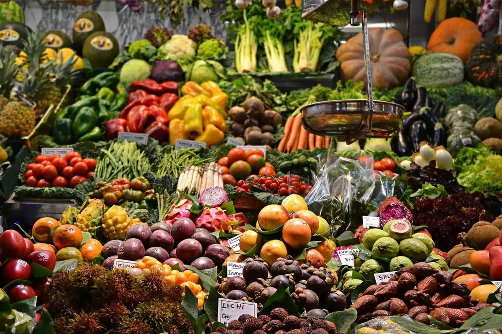 A market stall of fruit and vegetables.